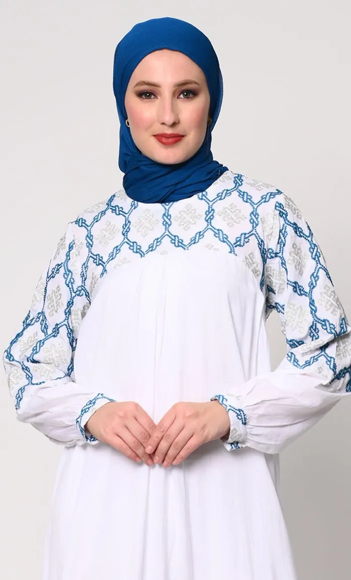 Elegant Simplicity: Embroidered White Abaya with Box Pleats and Dual Pockets