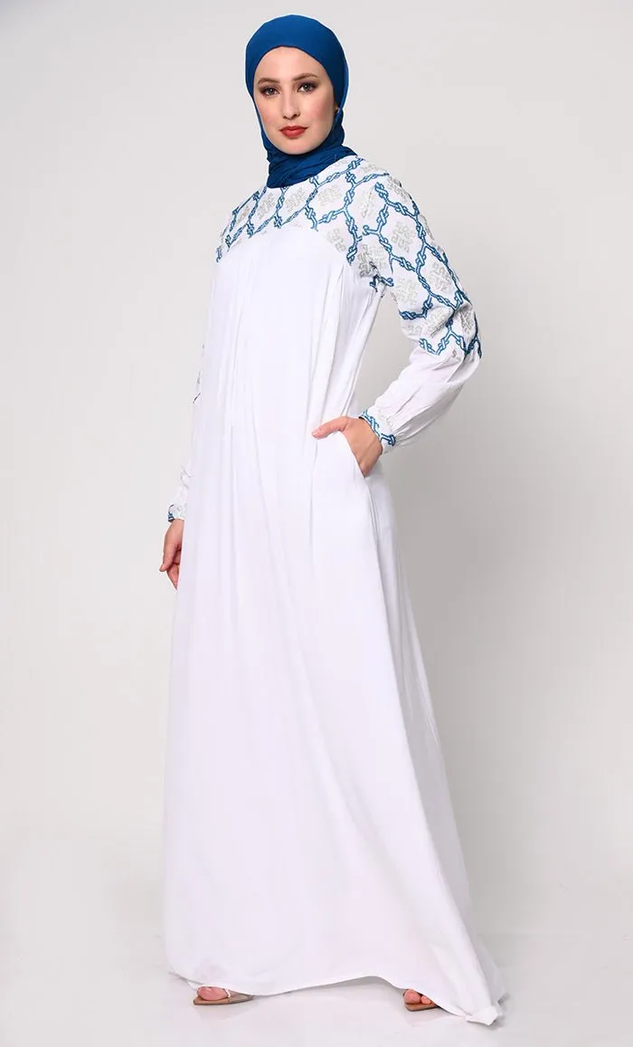Elegant Simplicity: Embroidered White Abaya with Box Pleats and Dual Pockets